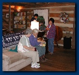 Cathy, Patty and Lari check out the plant book